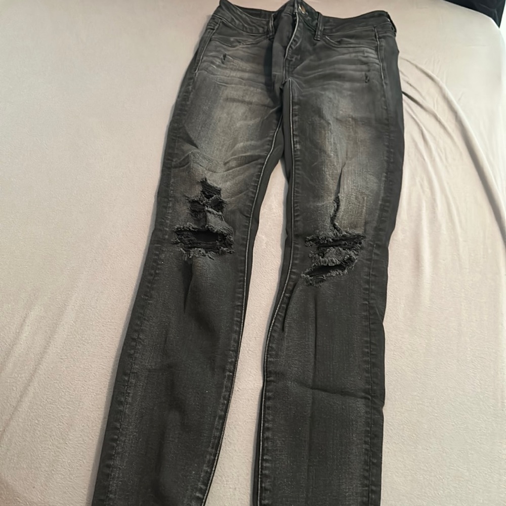 Distressed black American eagle jeans